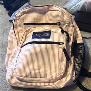 Pink and white Jansport backpack